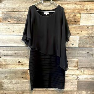 Black Stretch dress with flowy top.